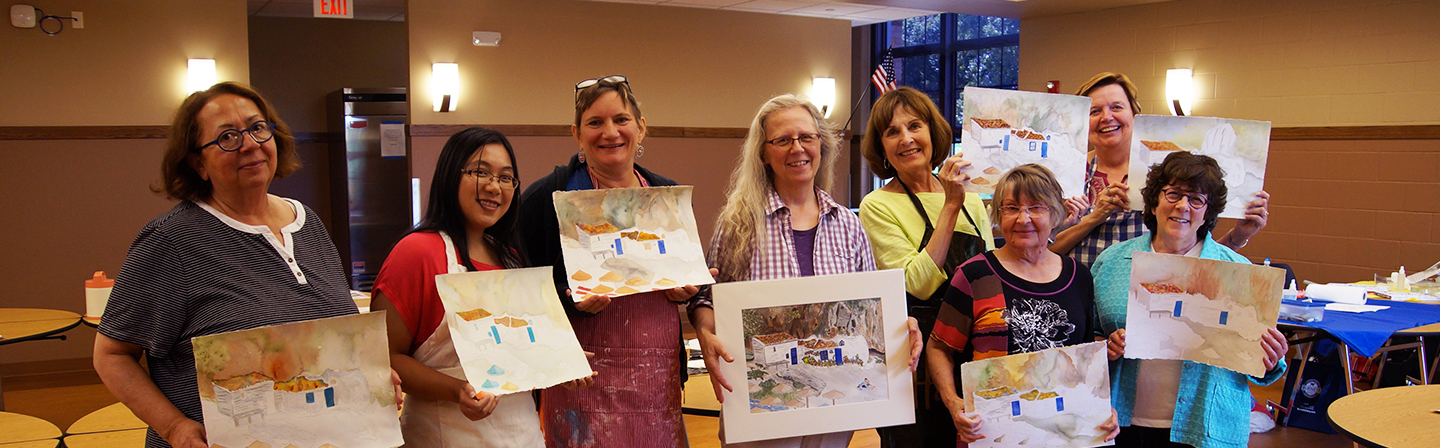 a group of adults at a watercolor class